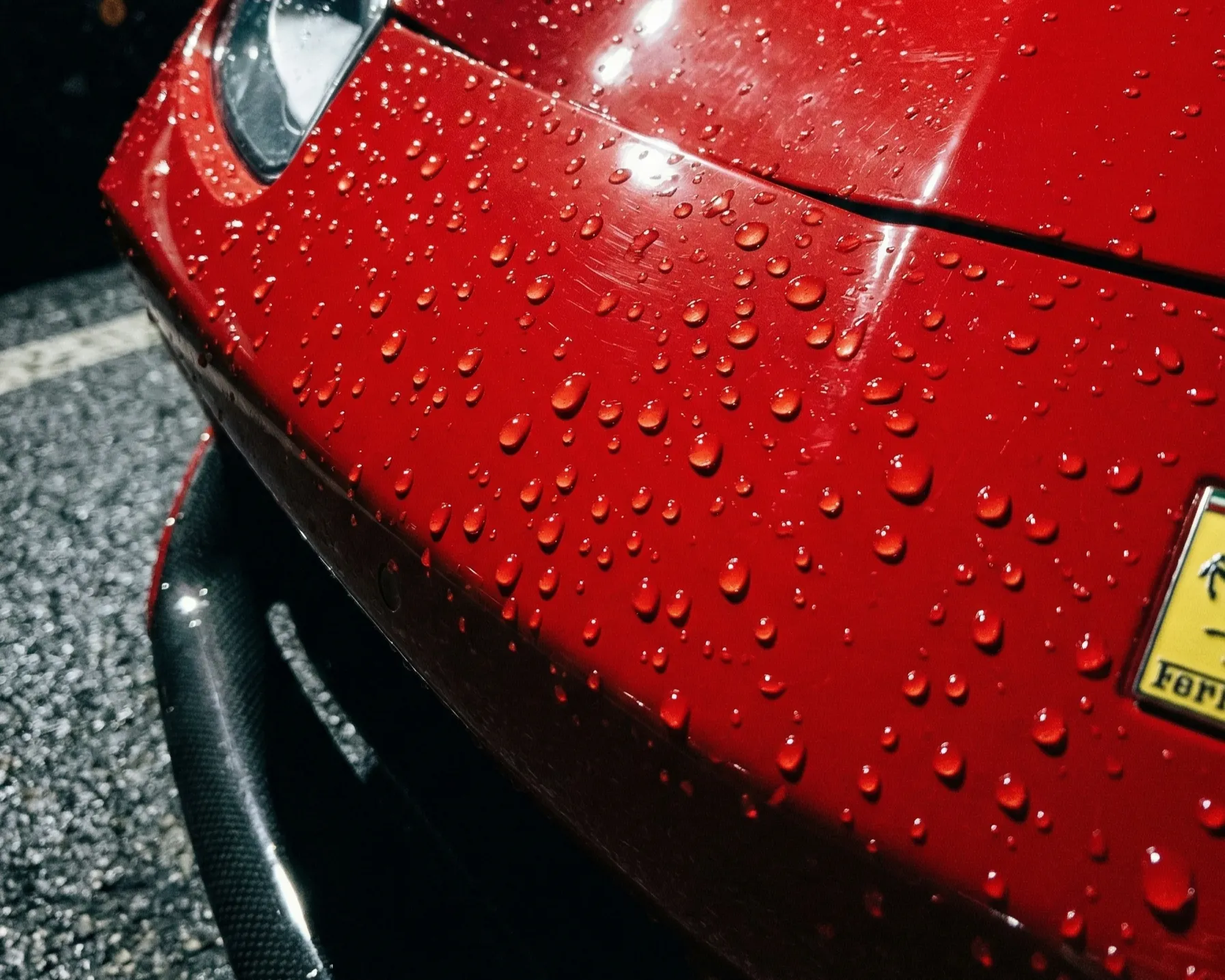 Water beading on a ceramic coated Ferrari